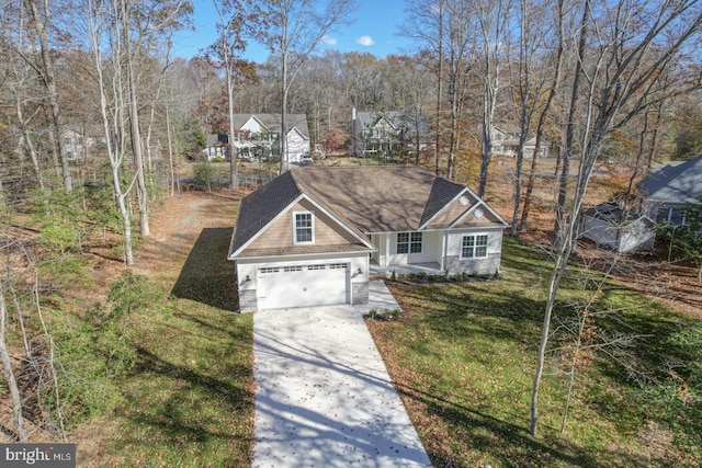 view of front of house with a front yard and a garage