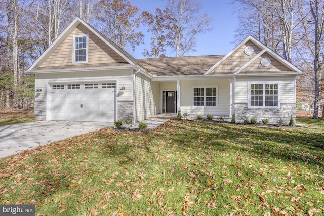 view of front of house with a front yard and a garage