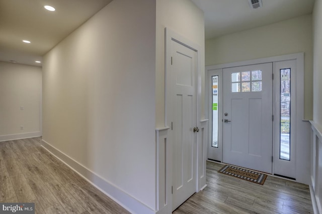 foyer entrance with light wood-type flooring