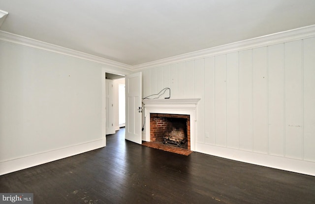 unfurnished living room featuring dark hardwood / wood-style flooring and crown molding