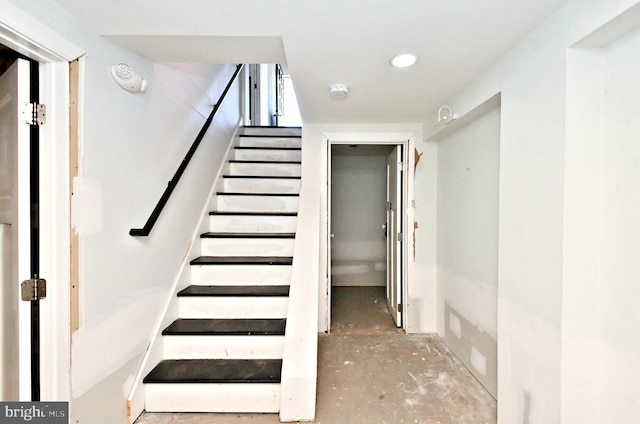 stairs with concrete floors