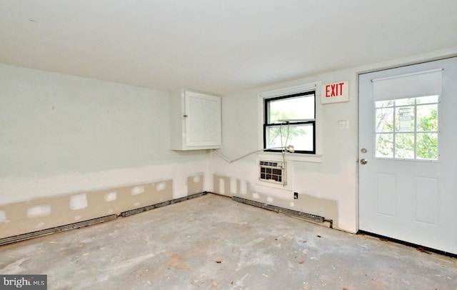 interior space with baseboard heating and heating unit