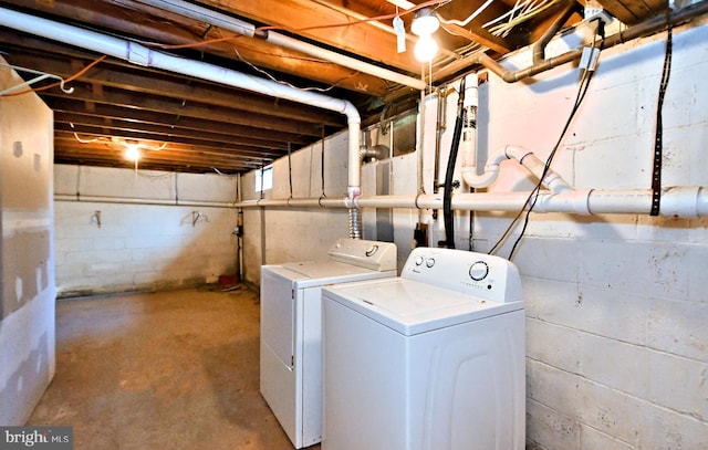 washroom with washer and dryer