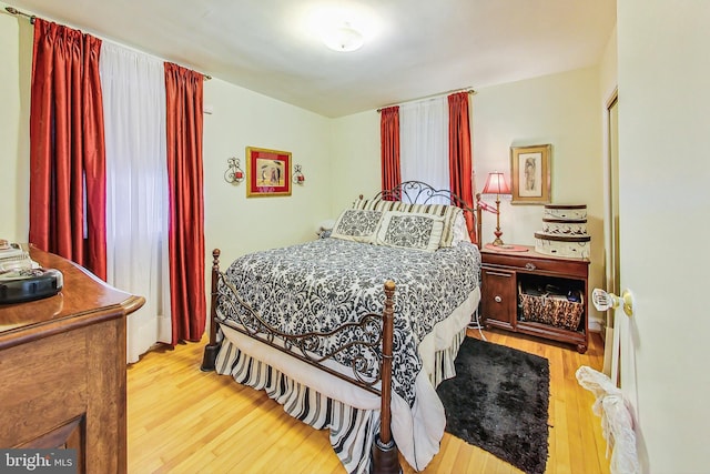 bedroom with light hardwood / wood-style floors