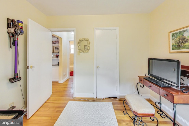 office with light hardwood / wood-style flooring