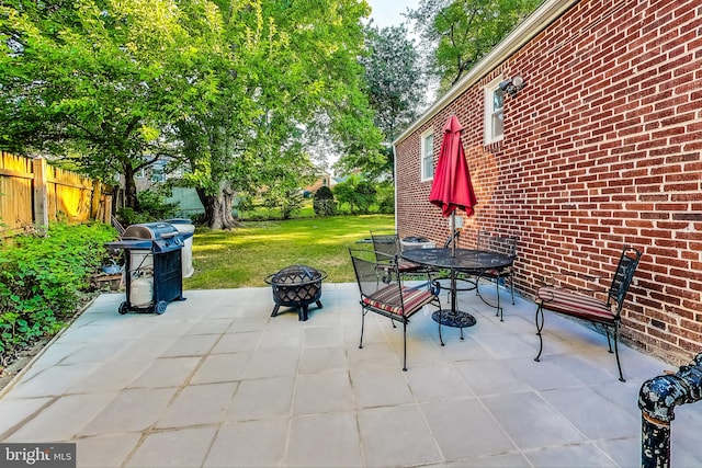 view of patio featuring grilling area and an outdoor fire pit