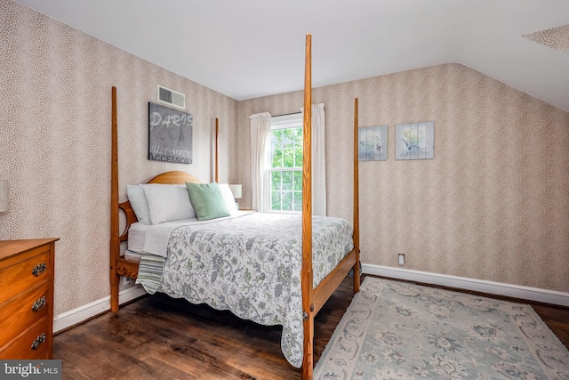 bedroom featuring dark hardwood / wood-style flooring