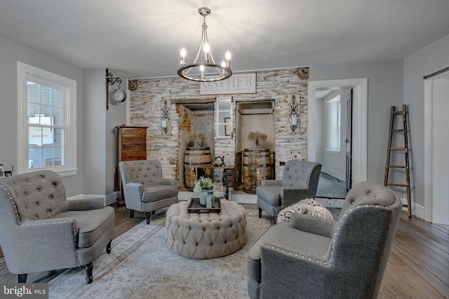 living room featuring a notable chandelier and light hardwood / wood-style flooring