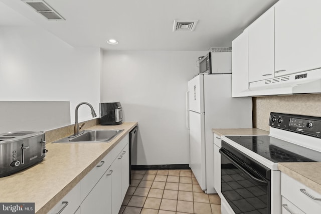 kitchen featuring light tile patterned floors, white cabinetry, range with electric stovetop, stainless steel dishwasher, and sink