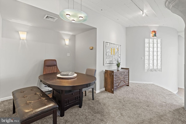 view of carpeted dining space