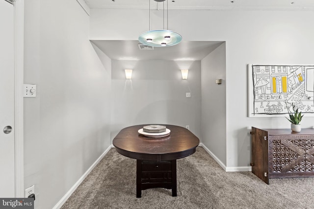 view of carpeted dining area