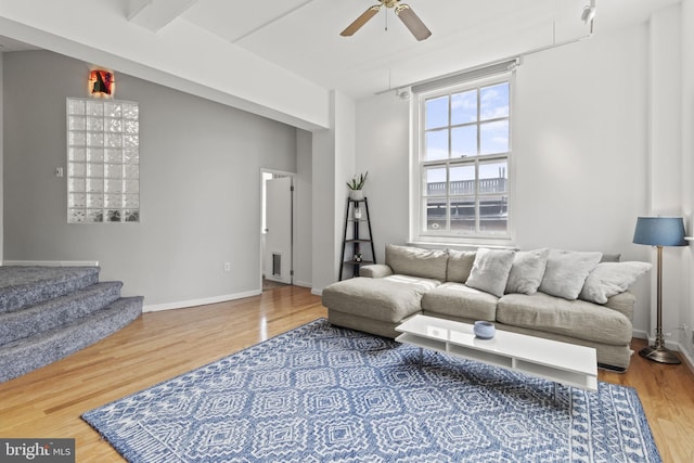 living room with ceiling fan and hardwood / wood-style floors