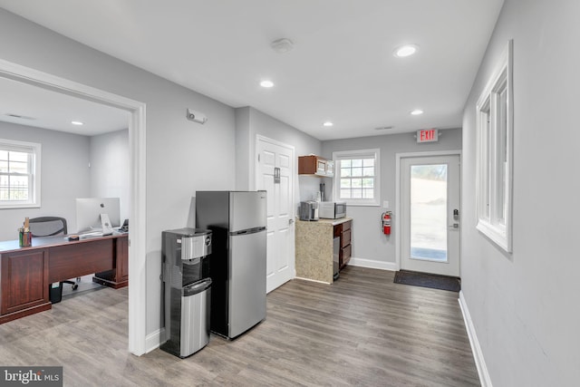 8504 Miramar Rd, Pasadena, MD 21122 - kitchen featuring stainless steel appliances, baseboards, an office area, wood finished floors, and recessed lighting