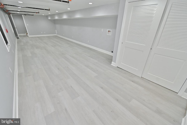 basement featuring light wood-type flooring