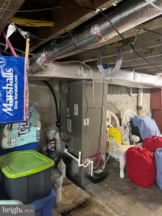 utility room featuring heating unit