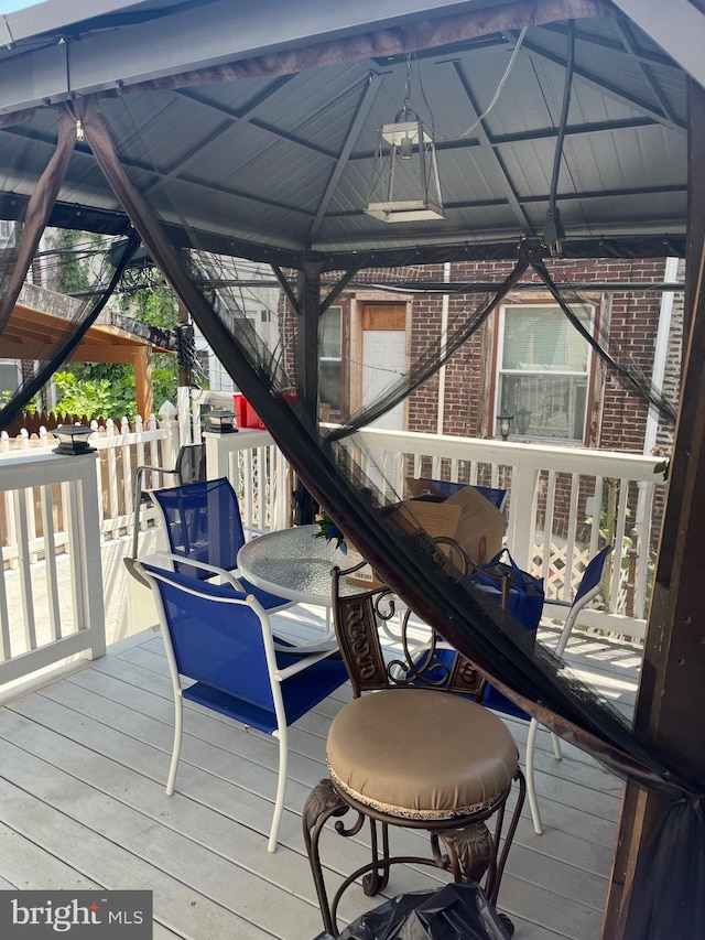 wooden deck featuring a gazebo