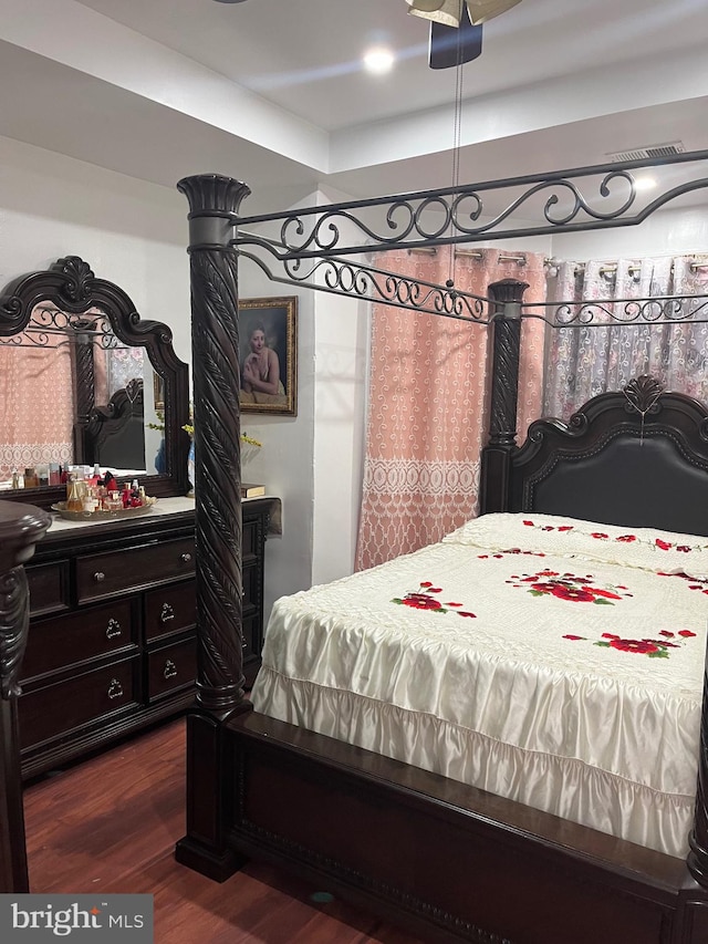 bedroom featuring dark hardwood / wood-style flooring