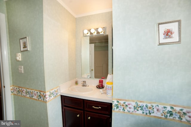 bathroom featuring vanity and ornamental molding