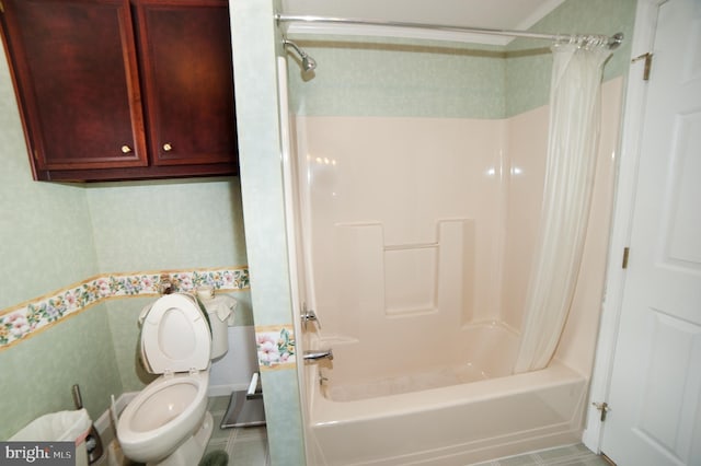 bathroom featuring tile patterned floors, toilet, and shower / bath combo with shower curtain