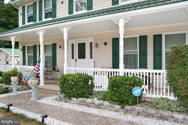 entrance to property with covered porch