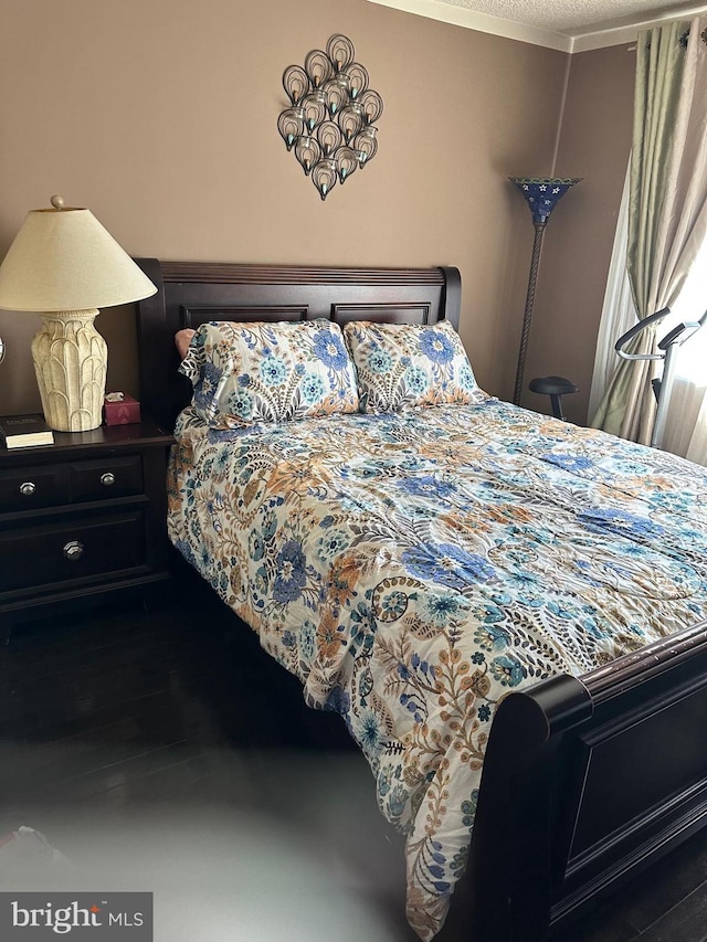 bedroom with ornamental molding