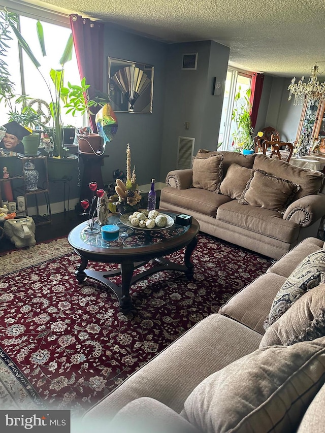 living room with plenty of natural light and a textured ceiling