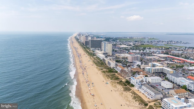 bird's eye view featuring a city view, a beach view, and a water view