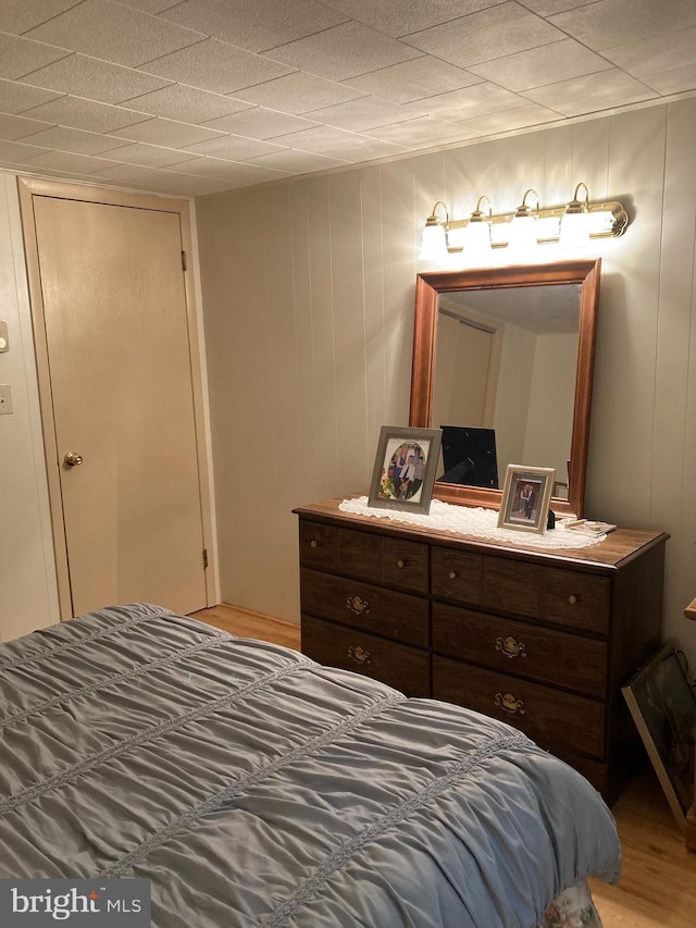 bedroom with hardwood / wood-style floors