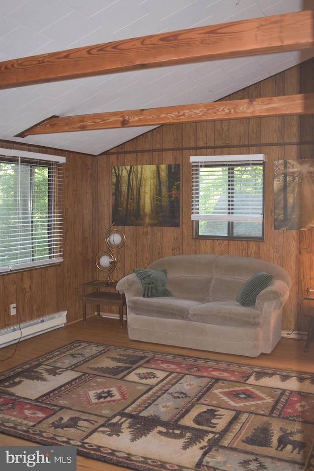 living room featuring plenty of natural light, wooden walls, and lofted ceiling with beams