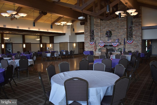 dining space featuring wood ceiling, high vaulted ceiling, and beamed ceiling