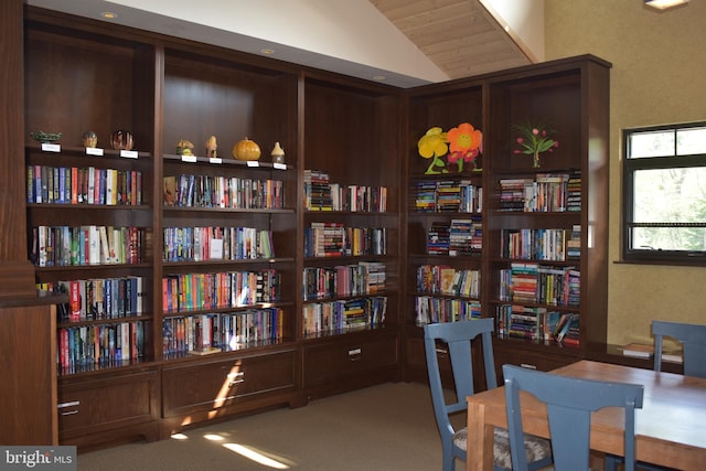 office space with lofted ceiling, wooden ceiling, and carpet