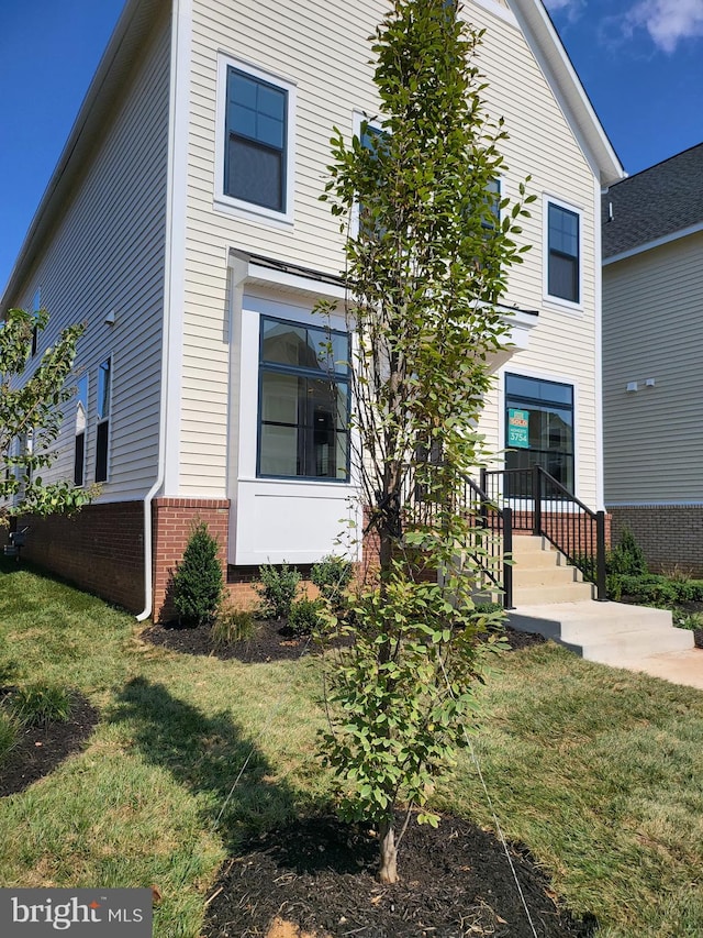 view of property exterior featuring a yard