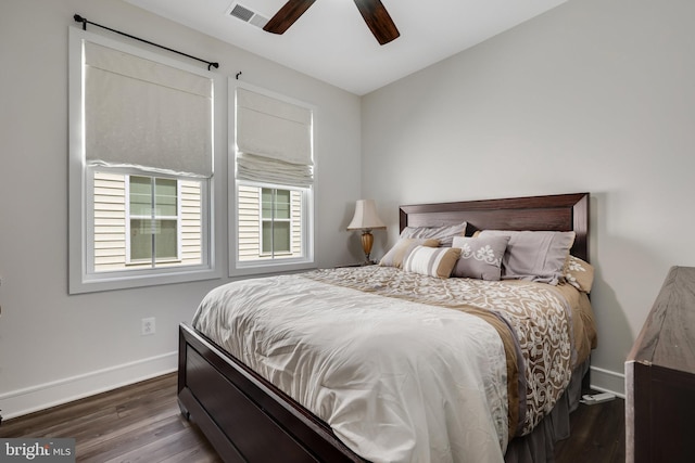 bedroom featuring dark hardwood / wood-style floors and ceiling fan