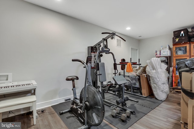 workout room with hardwood / wood-style floors