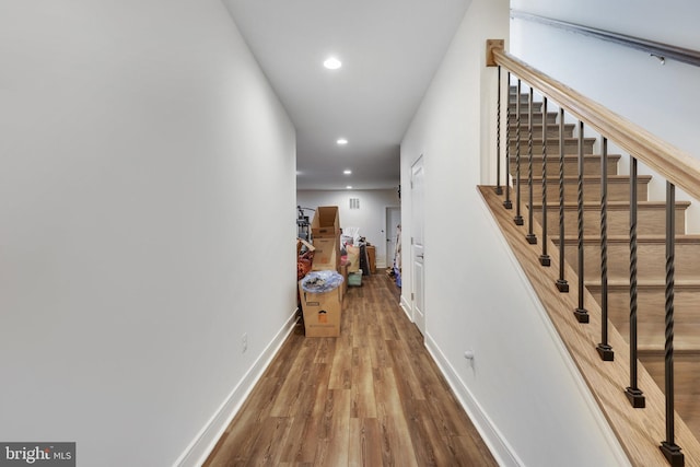 hall with wood-type flooring