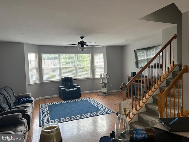 living room with ceiling fan and hardwood / wood-style floors