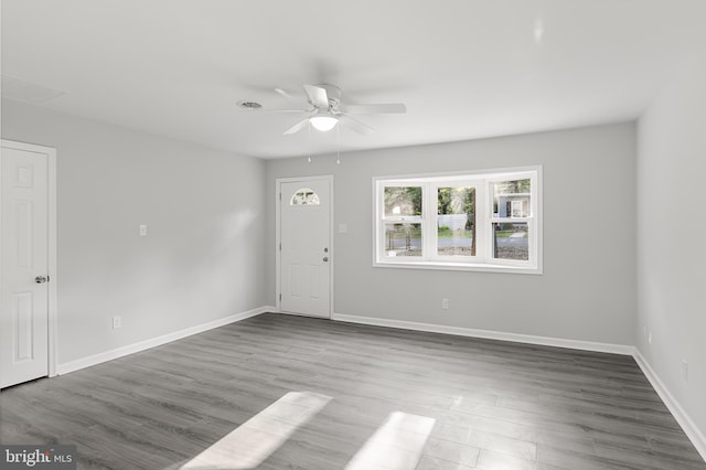 spare room with wood-type flooring and ceiling fan