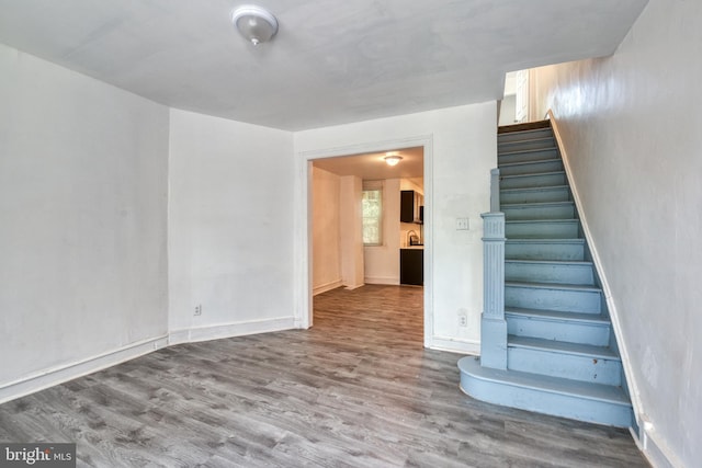 stairs featuring hardwood / wood-style flooring