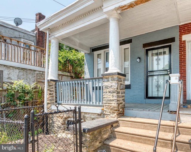 doorway to property featuring a porch