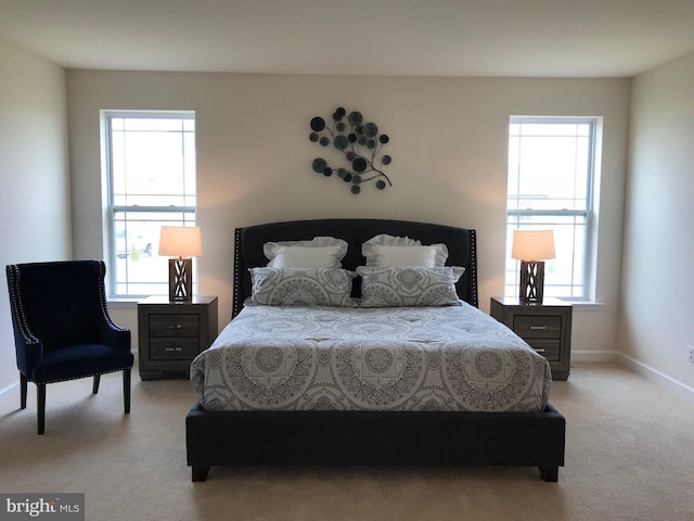 bedroom featuring light carpet