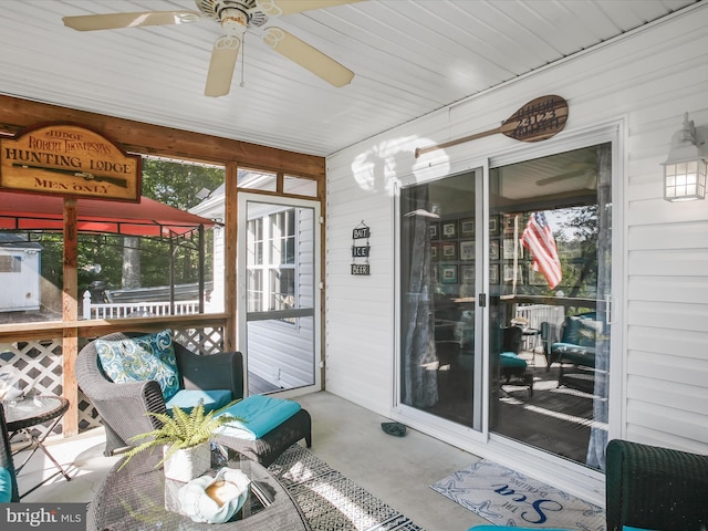 sunroom / solarium with ceiling fan