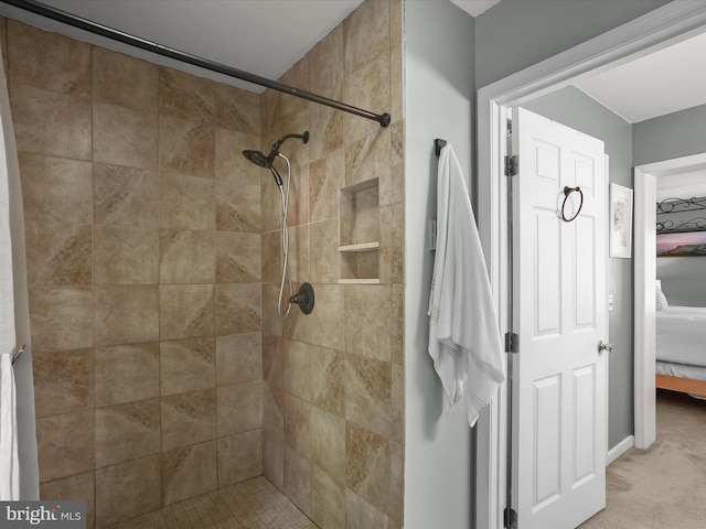 bathroom with tiled shower