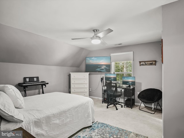 bedroom featuring ceiling fan, carpet flooring, and vaulted ceiling