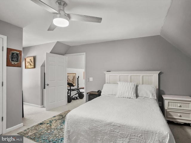 carpeted bedroom featuring ceiling fan and lofted ceiling