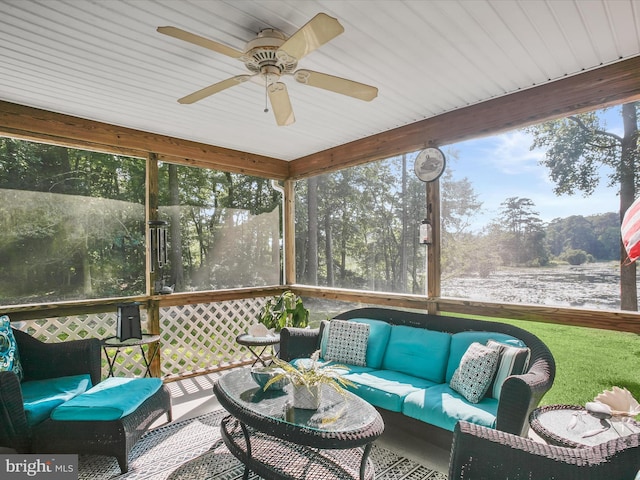 sunroom / solarium featuring ceiling fan