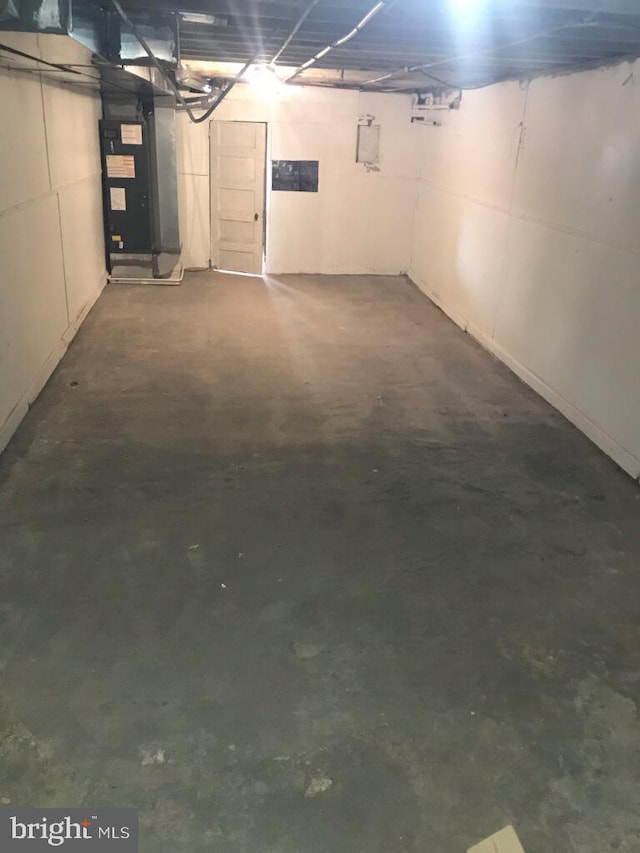 basement featuring heating unit