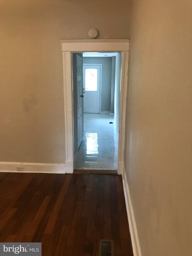 hallway featuring dark hardwood / wood-style floors