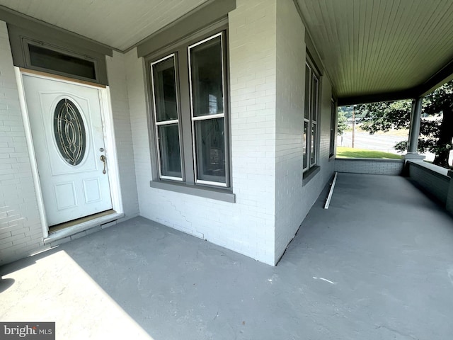 doorway to property with a porch