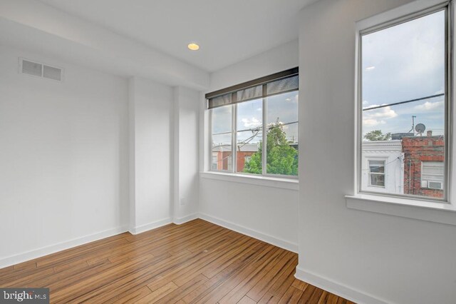 empty room featuring hardwood / wood-style floors