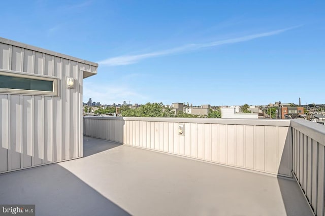 view of patio featuring a balcony